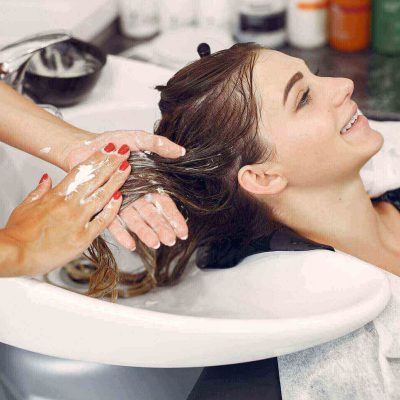 woman-washing-head-hairsalon-scaled-1